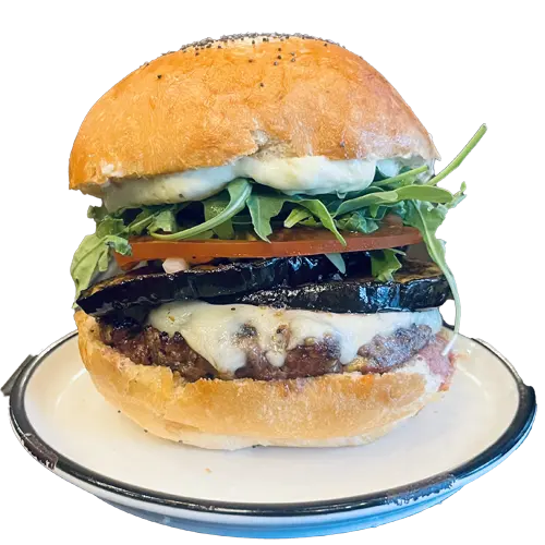 Rital - Burger avec steak, cheddar, pesto, bacon, onion rings, salade et tomate. Commandez maintenant !